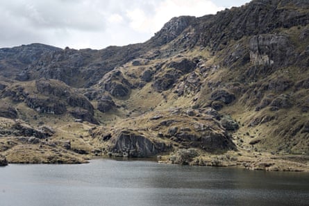 A body of water surrounded by rocky hills