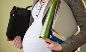 Pregnant woman carrying work papers