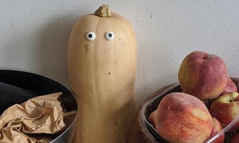 Shelf of squash with googly eyes stuck to them