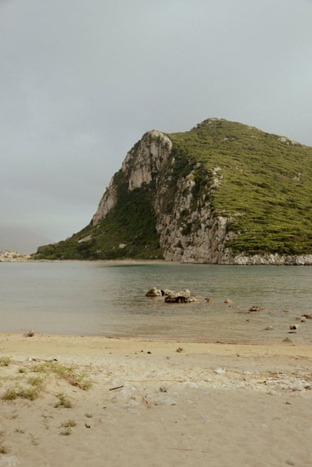 A beach, water and headland