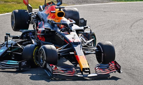 Max Verstappen’s car is on top of Lewis Hamilton’s Mercedes, but Hamilton survived thanks to the halo.