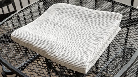 The Cozy Earth Waffle Towel on a table outside