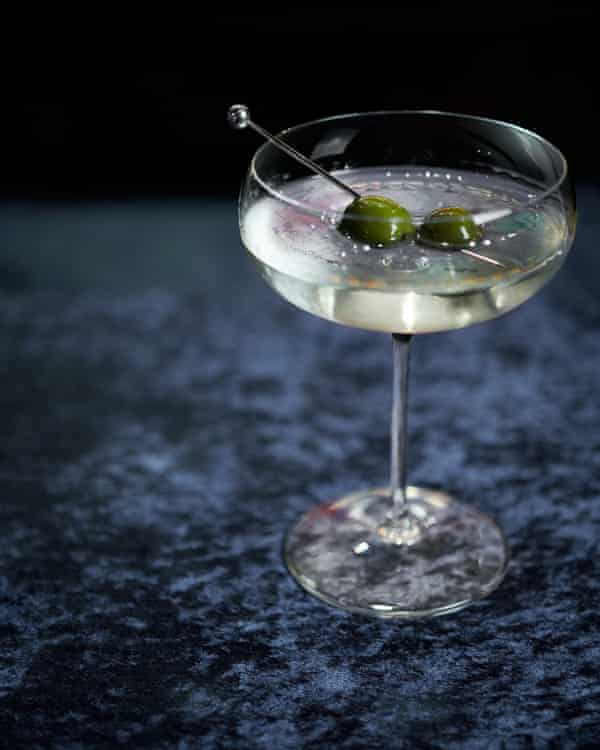 Elegant White Martini cocktail with an olive