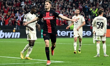 Josip Stanisic celebrates after scoring an equaliser for Bayer Leverkusen against Roma.