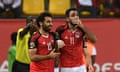 Karahba (right) celebrates his late winner with team-mate Mohamed Salah.