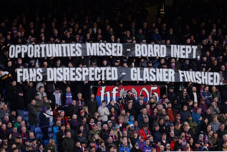 Crystal Palace fans unveil a banner critical of the board and Oliver Glasner before the win against Wolves on Sunday
