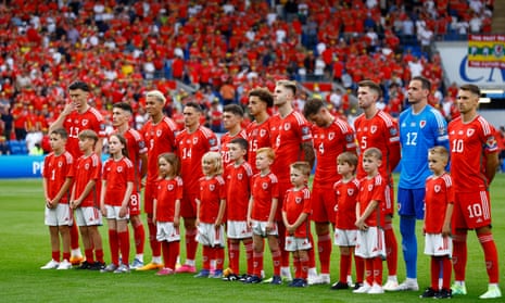 Wales players line up with mascots before the Euro 2024 qualifier against Armenia.