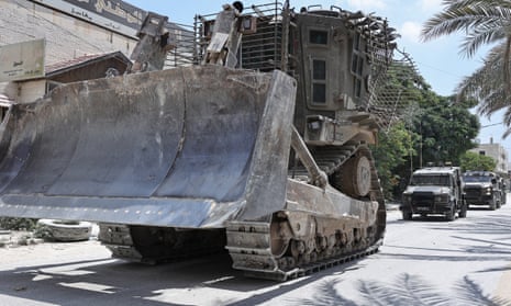 Israeli forces are pictured withdrawing heavy machinery used to target and destroy houses from the Nur Shams camp on 1 July.
