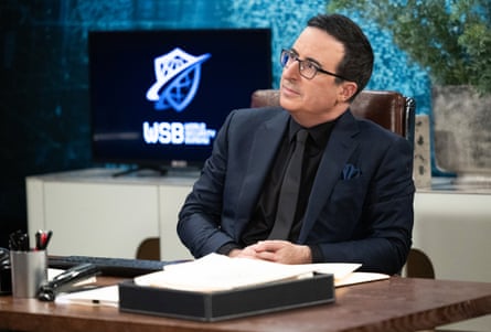 a man sits at a desk