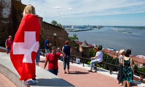 A Switzerland fan looks over the river Volga in front of the Nizhny Novgorod Stadium.