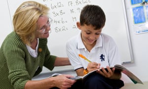 A primary school pupil works on his times tables