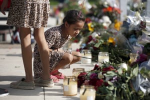 Child and floral tributes