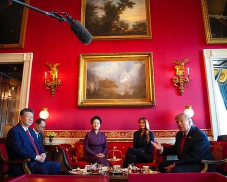 Donald and Melania Trump sitting with Xi Jinping and Peng Liyuan surrounded by paintings in the Red Room at the White House