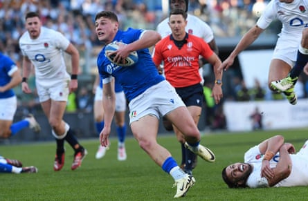 Italy’s Alessandro Garbisi on his way to scoring a try against England