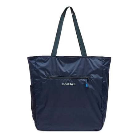 A navy Montbell tote bag. There is a side pocket with a Montbel logo.