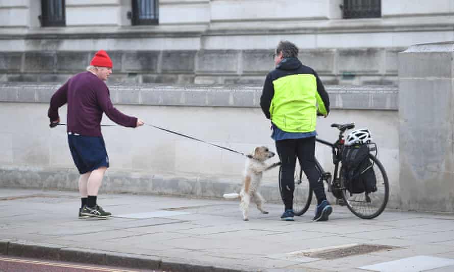 Boris Johnson out with his dog, and a passerby