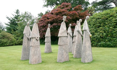 Eight bronze cardinals in Leonardslee gardens