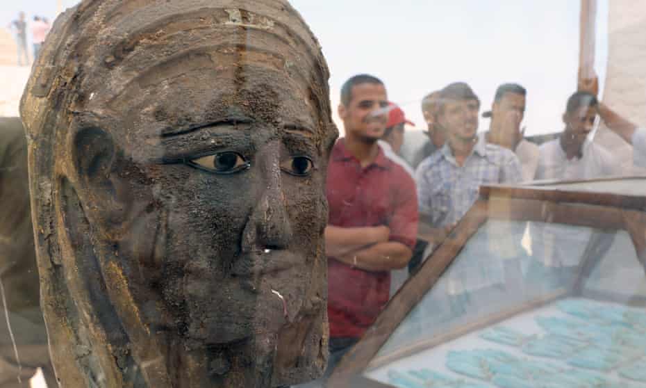 A gilded silver mask at the dig site near the Saqqara necropolis, Egypt