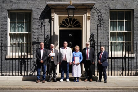 Chair of Haemophilia Northern Ireland Nigel Hamilton, Richard Newton, Conan McIlwrath, Chief Executive of Haemophilia Society Kate Burt, Chair of APPG Clive Efford MP and Robin Swann MP in front of 10 Downing Street.