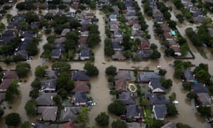 Houses are seen submerged in flood waters caused by Tropical Storm Harvey in Houston Wednesday.