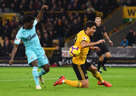 Raul Jimenez goes down in the box after a challenge by Christian Atsu.
