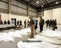 Military officials inspect rows of body bags after an anti-narcoterrorism operation