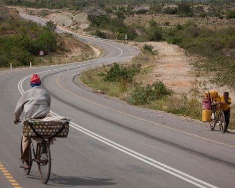 Traffic moves along the newly rehabilitated Tanga ? Horohoro trunk road in Northeastern Tanzania.<br>FA6E59 Traffic moves along the newly rehabilitated Tanga to Kenya - Tanzania border traffic at Horo Horo trunk road, Northeastern Tanzania, 30 October 2012