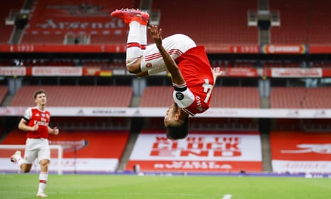 Arsenal’s Pierre-Emerick Aubameyang celebrates with a somersault after scoring their third goal