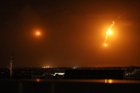 Flares fired by Israeli troops light up the sky over Khan Younis in southern Gaza.