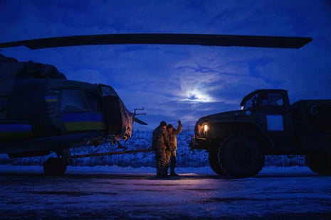 Ukrainian military crew members of the 18th Separate Army Aviation Brigade prepare a helicopter Mi-8 before take off in eastern Ukraine.