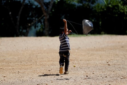 A child plays with a plastic bag in the Corredor Seco of Guatemala 25 October 2019, where the drought causes dozens of cases of child malnutrition.