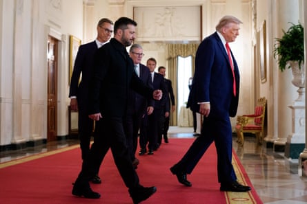 European leaders led by the president of Ukraine, Volodymyr Zelenskyy, follow Donald Trump in the Cross Hall of the White House, Washington DC, 18 August.
