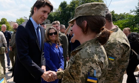 Canadian prime minister Justin Trudeau, accompanied by deputy prime minister and minister of finance Chrystia Freeland (centre) meets with soldiers in Kyiv, Ukraine.