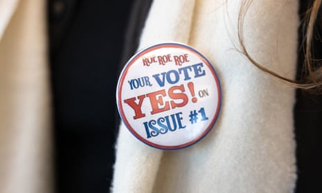 A woman wears a pro-choice button to a canvassing meeting ahead of the election in Columbus, Ohio. Reproductive rights are directly on the ballot in the state today.