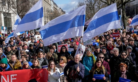 People attend a protest near the polling station at the Russian embassy in Berlin, after noon local time, on Sunday, 17 March 2024.