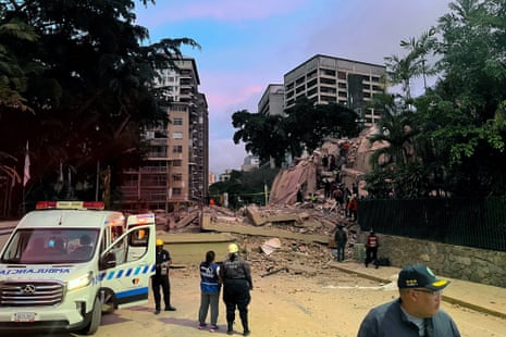 Rescuers search for victims in a collapsed building following an earthquake