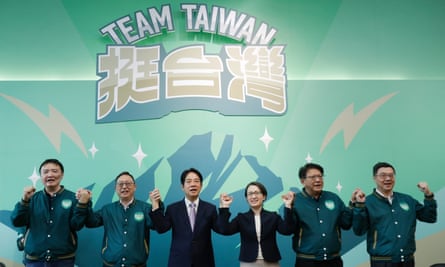 Taiwan Vice President William Lai, third fom left, the candidate for presidential election of the ruling Democratic Progressive Party (DPP), poses with his vice president candidate Hsiao Bi-kim, third from right