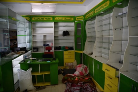 View of the empty shelves at a closed pharmacy in Rafah