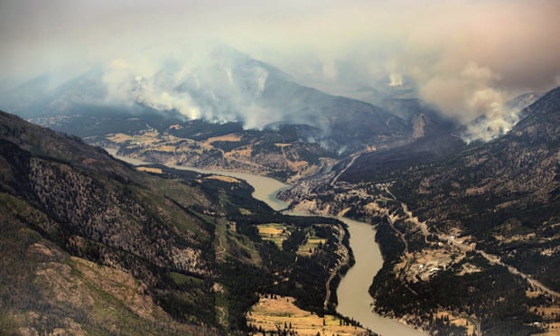 A wildfire burns in the mountains north of Lytton, British Columbia