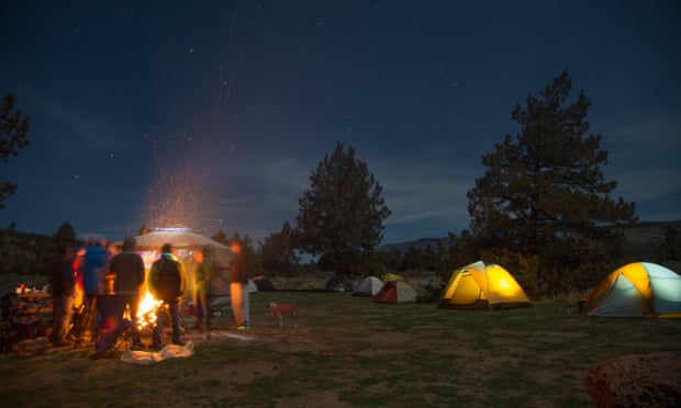 People around campsite fire, Smith Rock State Park, Oregon