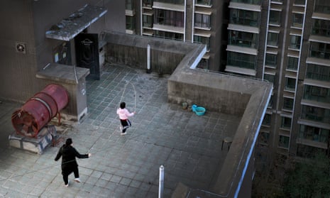 Residents exercising on a rooftop at a residential area in Xi’an, northwest China’s Shaanxi province.