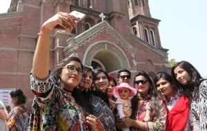 People in front of a church taking a selfie