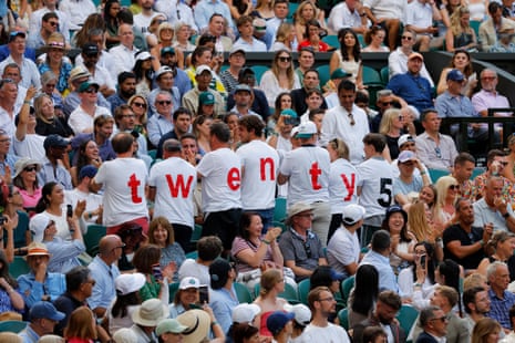Novak Djokovic fans connected Centre Court wearing t-shirts cheering him connected to his 25th Grand Slam..