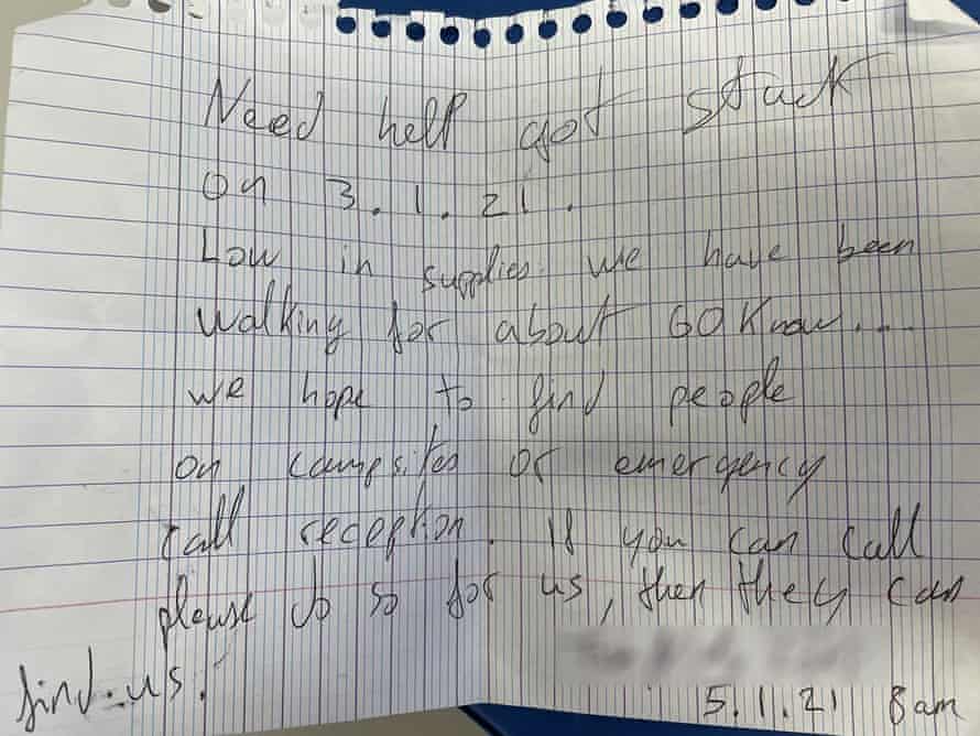 An SOS note written on gridded notepaper
