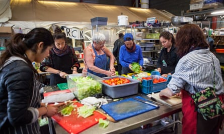Volunteers prepare meals for 2,000 in the Help Refugees kitchen.