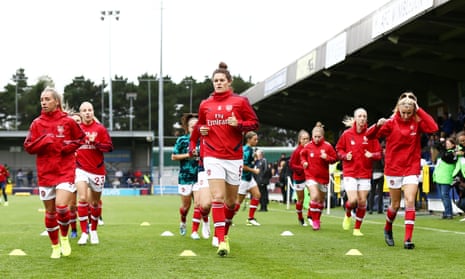 The Arsenal players warm up before the WSL game against Chelsea on Sunday, which they lost 2-1. 