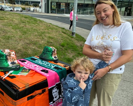 Catherine Hill and her son at a stall with Katie Taylor hats and scarves