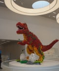 Prehistoric pain … a dinosaur steps on a Lego brick.