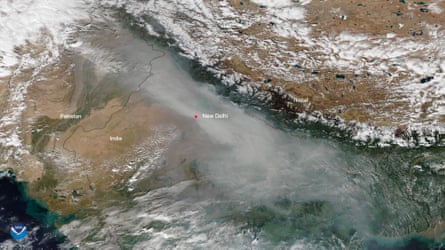 A satellite image taken on 31 October showing smog lingering over New Delhi