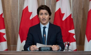 Prime Minister Justin Trudeau listens to a question during a news conference.